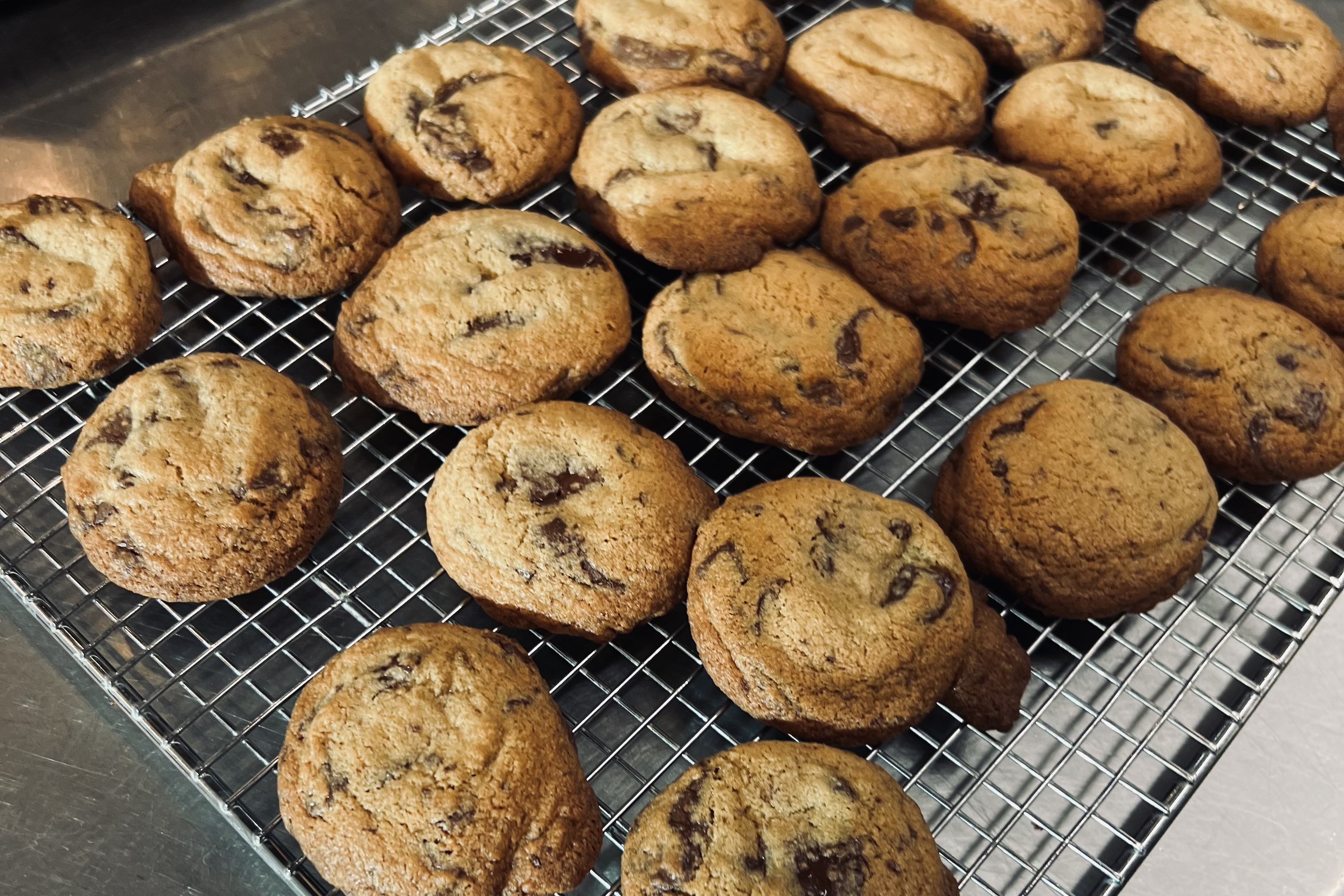 Chocolate chunk cookies cooling on a rack